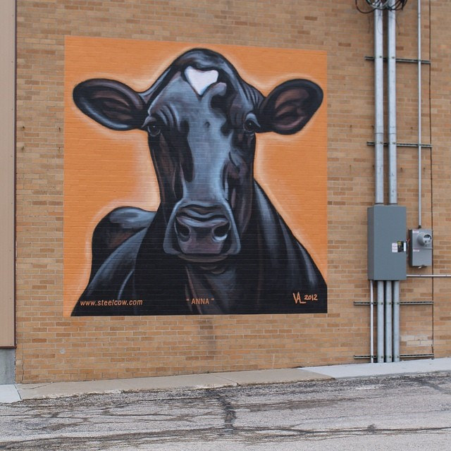Cow mural on the side of WW Homestead Dairy building