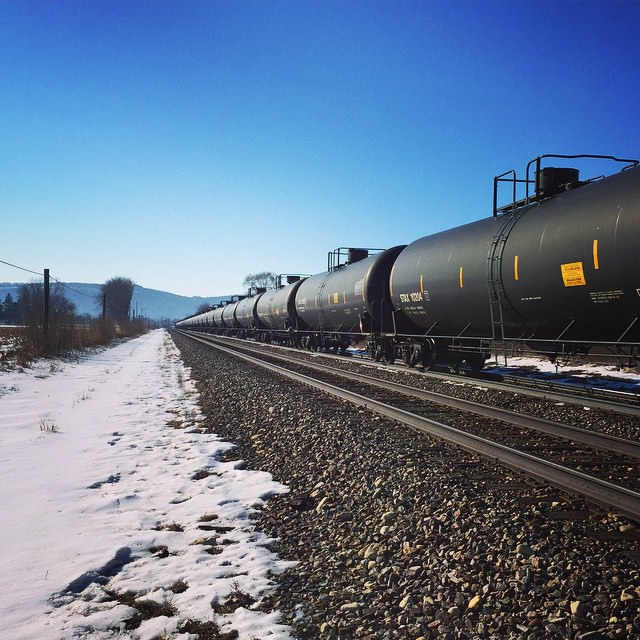 A freight train pulling hundreds of cars of crude oil
